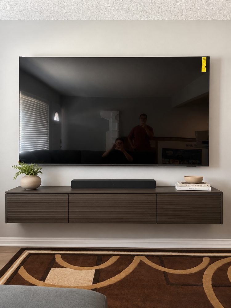 Finished TV install with soundbar and floating console